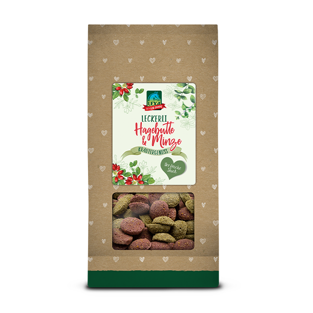 Pferdekräcker Hagebutte & Minze Die Kräcker sind in einer Grün braunen Verpackung (1kg Beutel) mit einem Etikett und einem Sichtfenster für die Leckerlis.