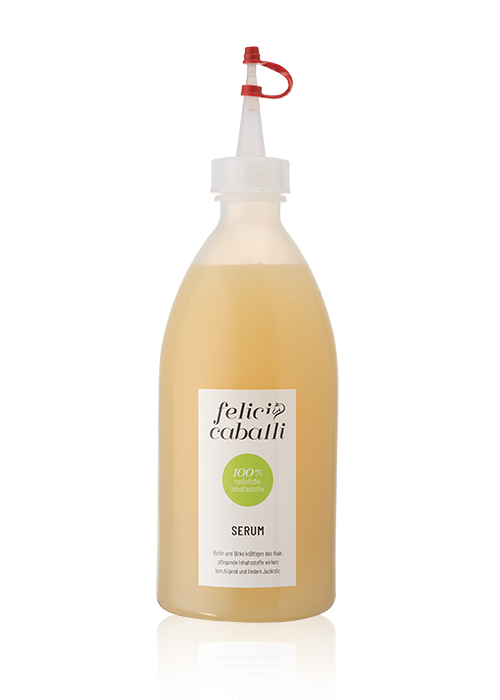 Flasche mit Serum von Felic Caballi, 100% natürliche Inhaltsstoffe, beige Flüssigkeit in einer transparenten Flasche.